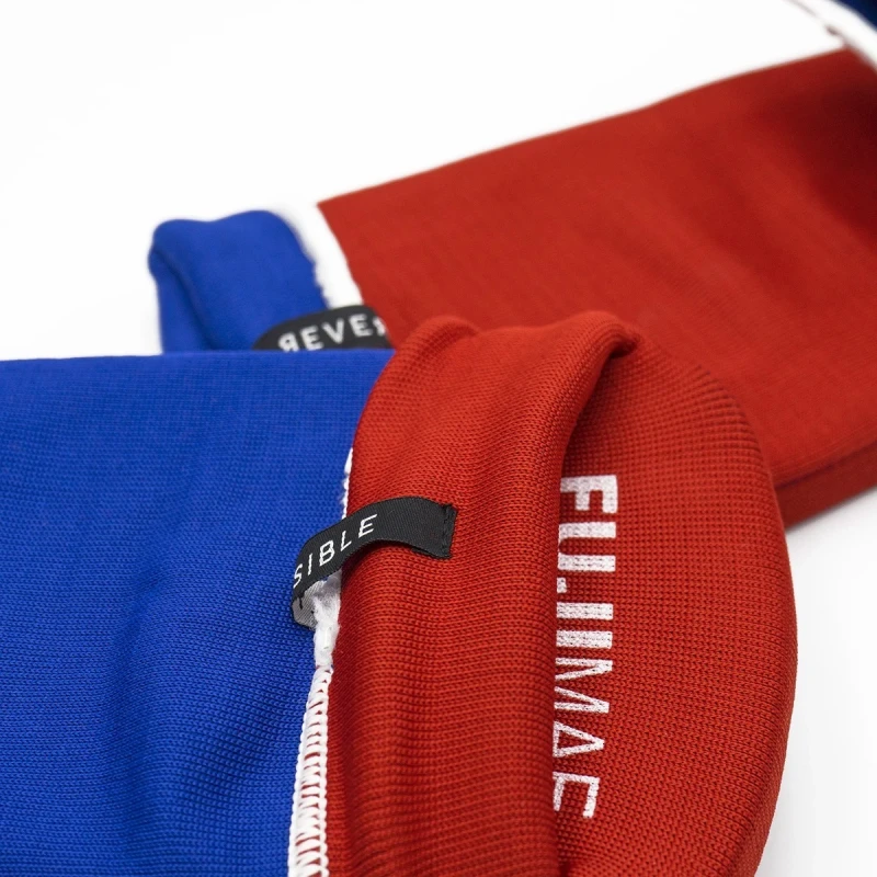 Dwustronne ochraniacze na piszczele w kolorach niebiesko-czerwonych